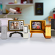 Image for article titled Your Next Collecting Obsession: Tiny TVs With Working Remotes That Play Clips From Popular Shows